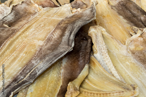 Fototapeta Naklejka Na Ścianę i Meble -  Pieces of a dried dogfish laying on the table at the food market