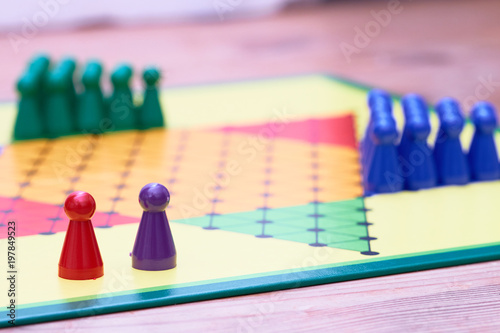 colorful play figures on board