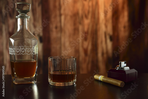 liqueur bottle with glass and cigar