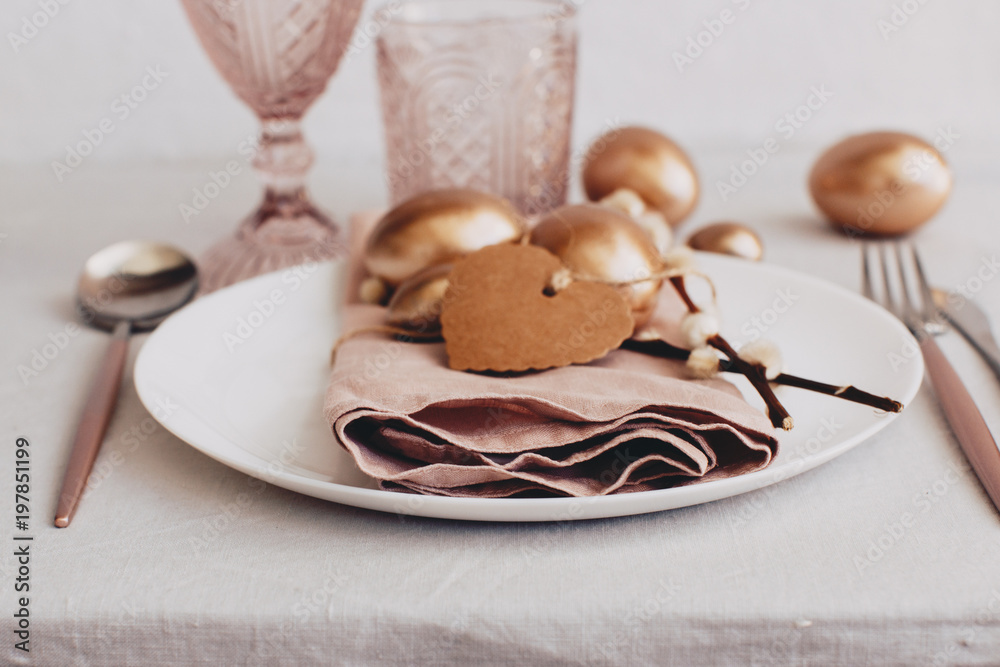 Rustic easter table place settings. Easter eggs over linen background. Top view