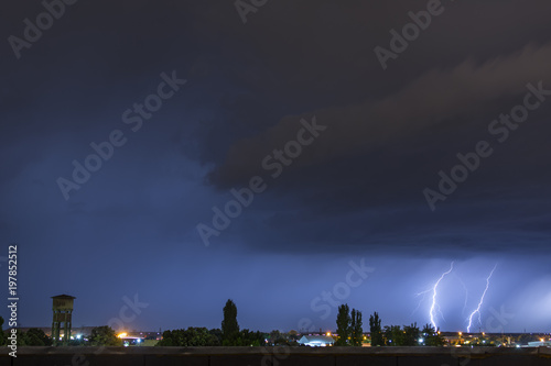 Lightning flash over a city lectricity blast storm