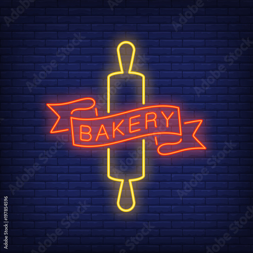 Bakery neon sign. Red ribbon and yellow rolling pin on brick wall. Night bright advertisement. Vector illustration in neon style for cafe and bakeshop