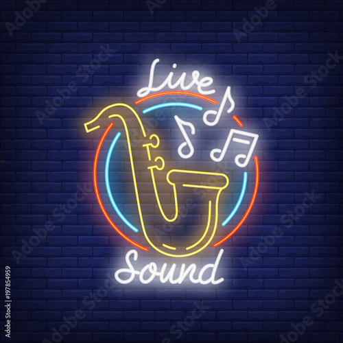 Live sound neon sign. Saxophone with music notes in round frame on brick wall. Night bright advertisement. Vector illustration in neon style for restaurant or concert