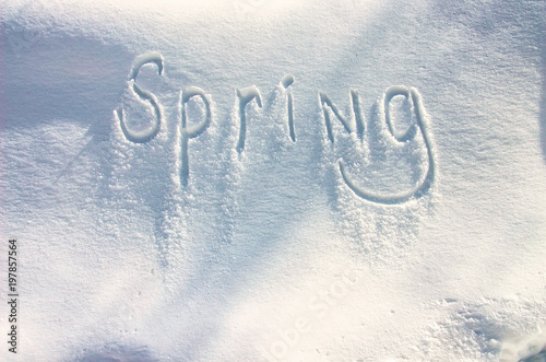 Spring - Snow Writing. Letters written on the snow surface. Frosty and sunny day