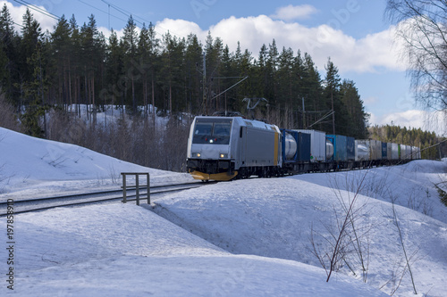 Freight train in winter landscape