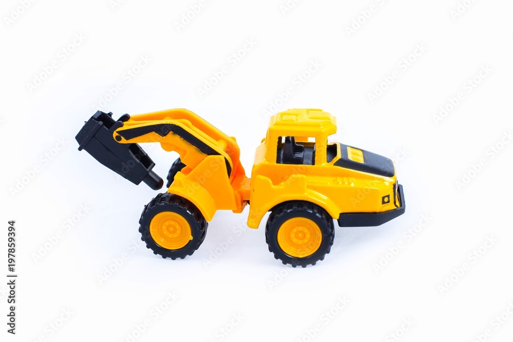 Fototapeta premium Toy construction vehicles Excavator industrial machine doing construction new road earthworks on white background