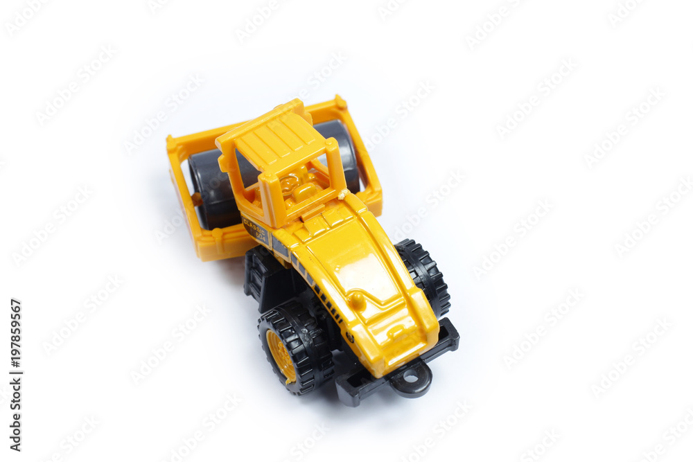 Fototapeta premium Toy construction vehicles Excavator industrial machine doing construction new road earthworks on white background