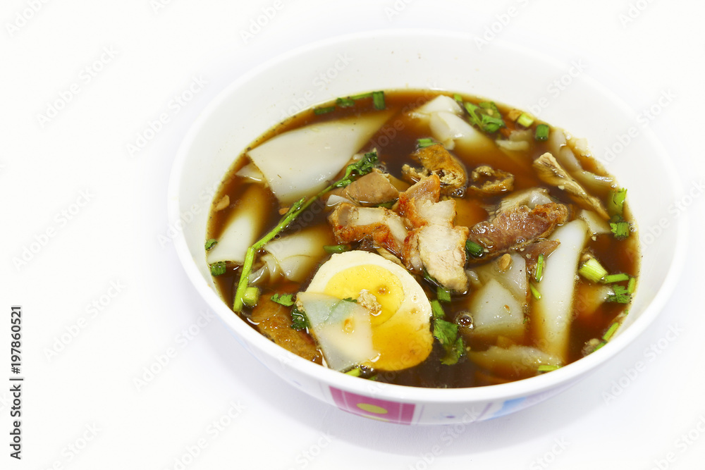 thai noodle soup with pork on plate isolate white background 