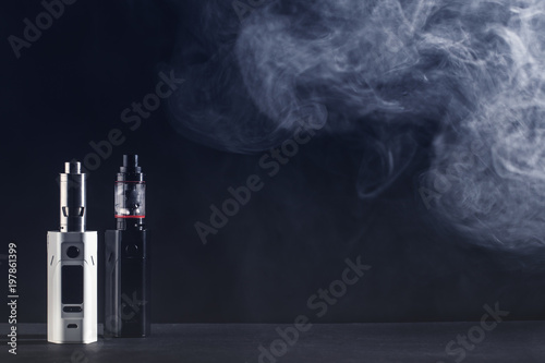 Electronic cigarette over a dark background. photo