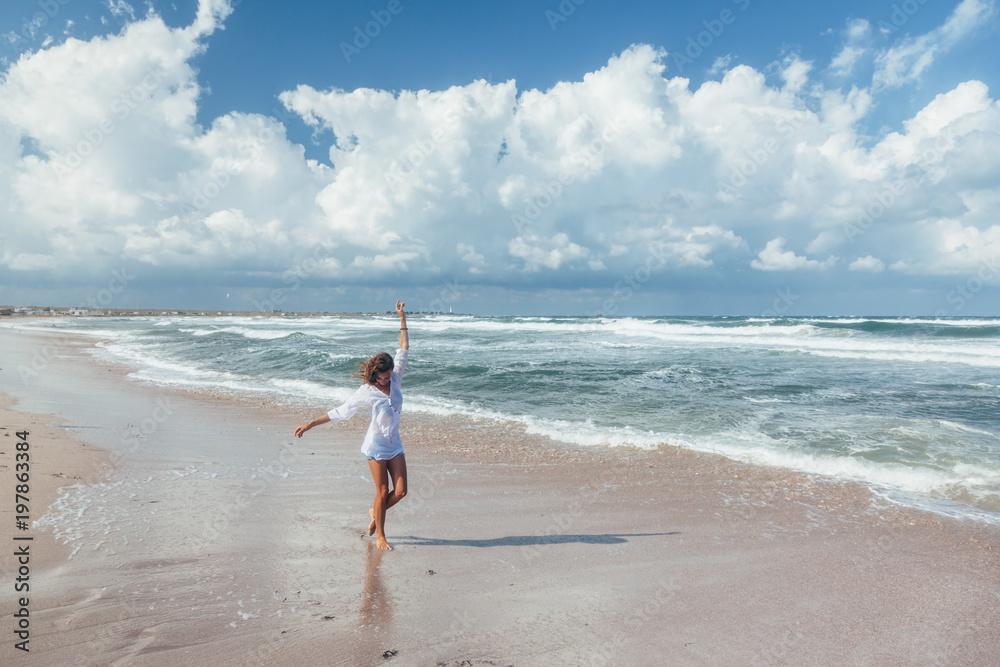 Girl walking on the beach