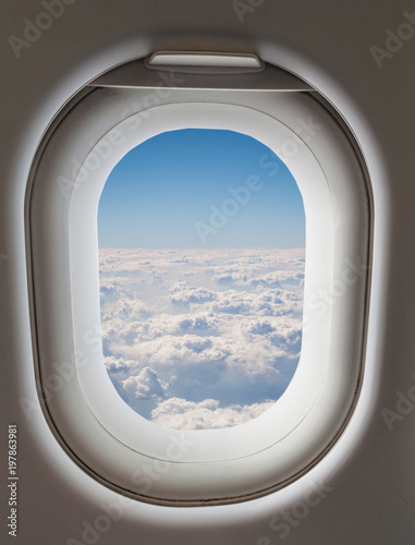 airplane Window showing beautiful sky background