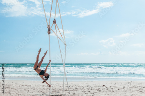 Pole dancer on the beach