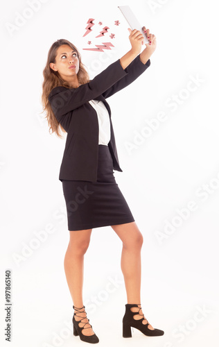 Beautiful young business woman working with a tablet; copy space photo, customizable background