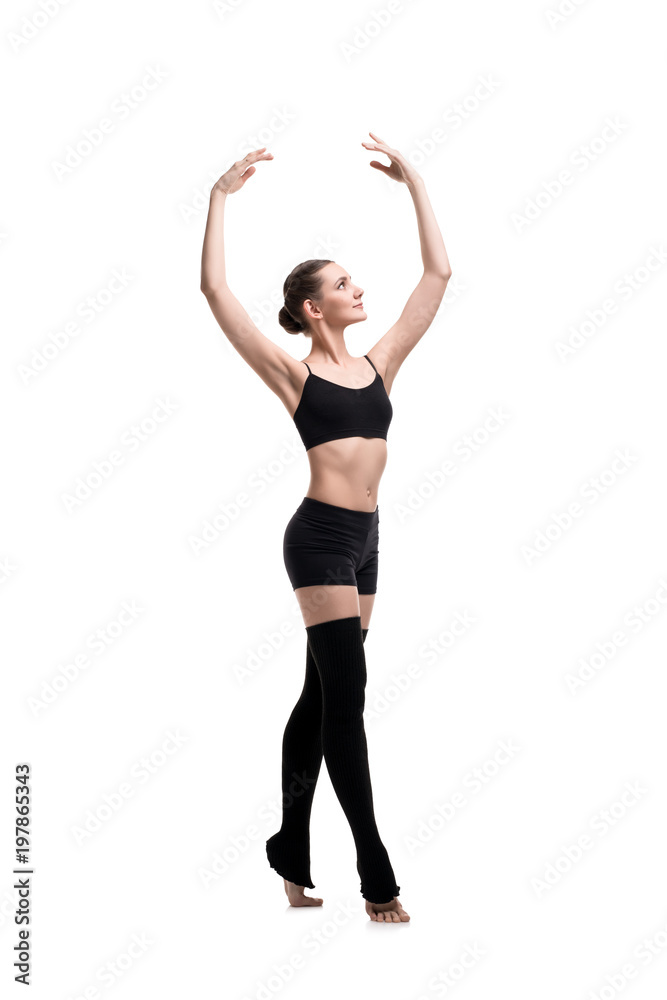 Slim girl in black sportswear dancing shot Slim girl in black sportswear dancing shot