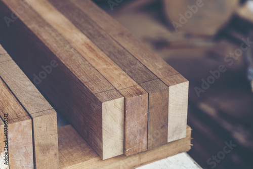 Background image of woodworking workshop: carpenters work table with different tools and wood cutting stand, vintage filter image photo