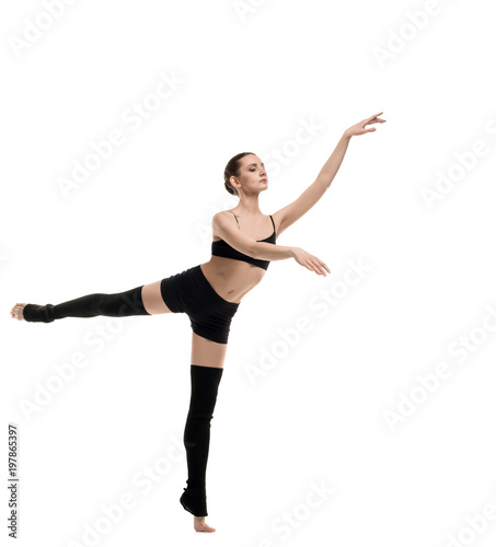 Slim girl in black sportswear dancing shot