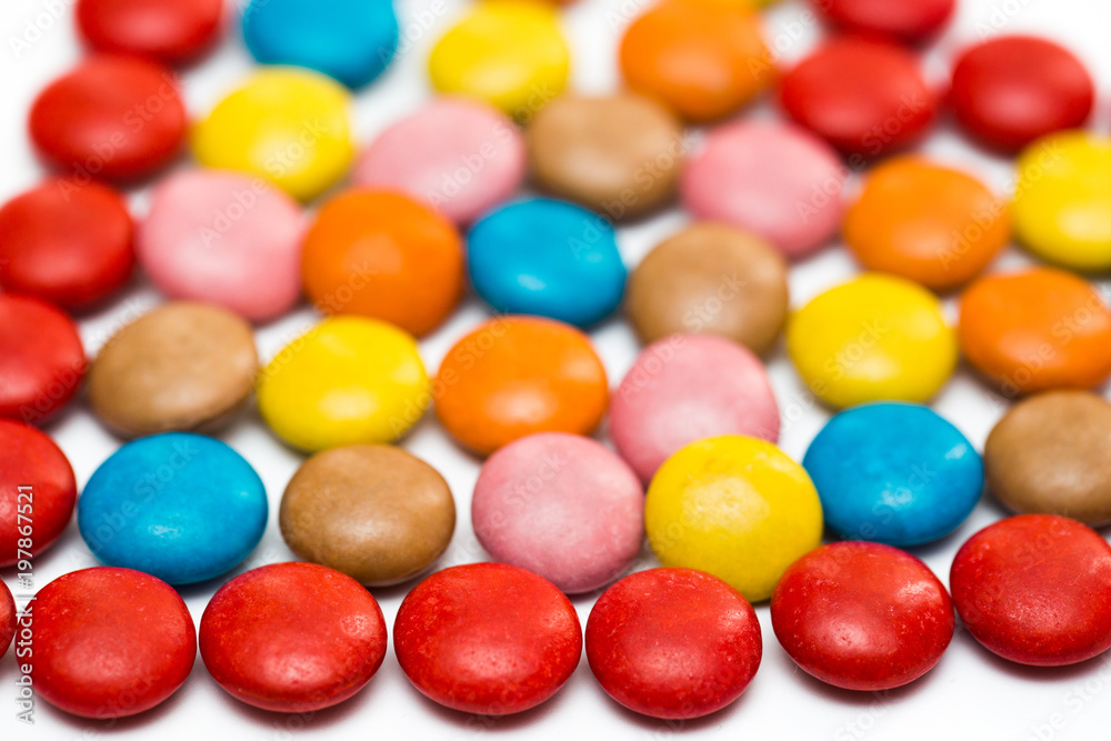 Close up of a pile of colorful chocolate coated candy, chocolate pattern, chocolate background Close up of a pile of colorful chocolate coated candy, chocolate pattern, chocolate background
