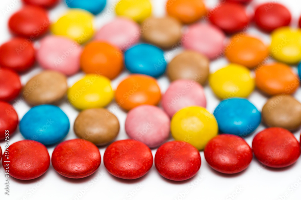 Close up of a pile of colorful chocolate coated candy, chocolate pattern, chocolate background Close up of a pile of colorful chocolate coated candy, chocolate pattern, chocolate background