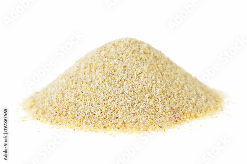 Dried granulated garlic on a white background