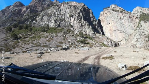 Trip on an off-road car in dolomite mountains photo