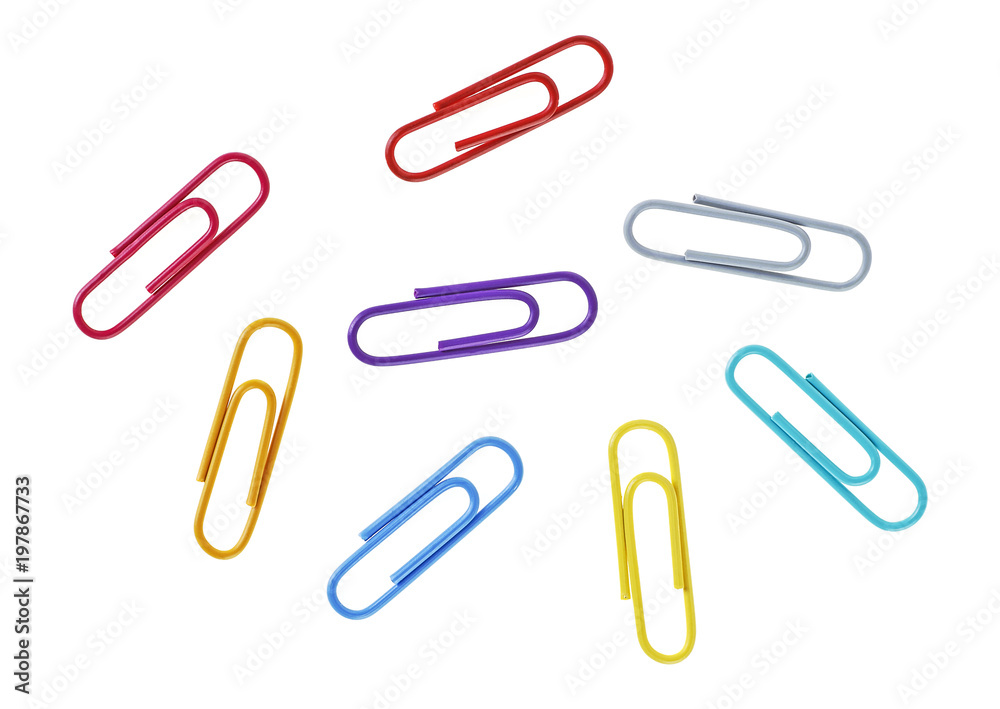 Colored paper clips on a white background, closeup Colored paper clips on a white background, closeup