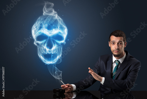 Businessman smoking with skull simbol above his head.