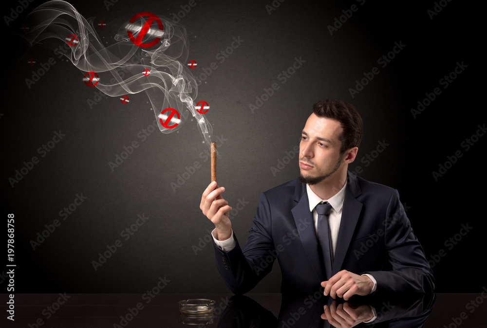 Businessman smoking with colored no smoking symbols nearby. Businessman smoking with colored no smoking symbols nearby.