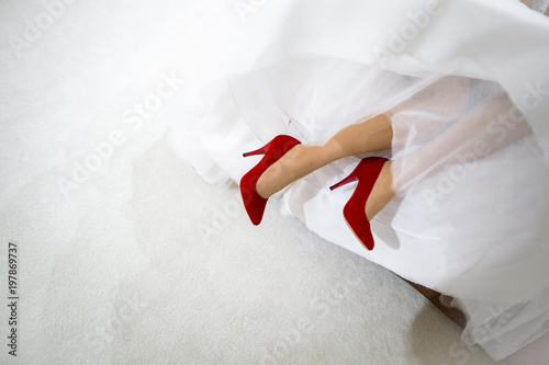 bride in red shoes