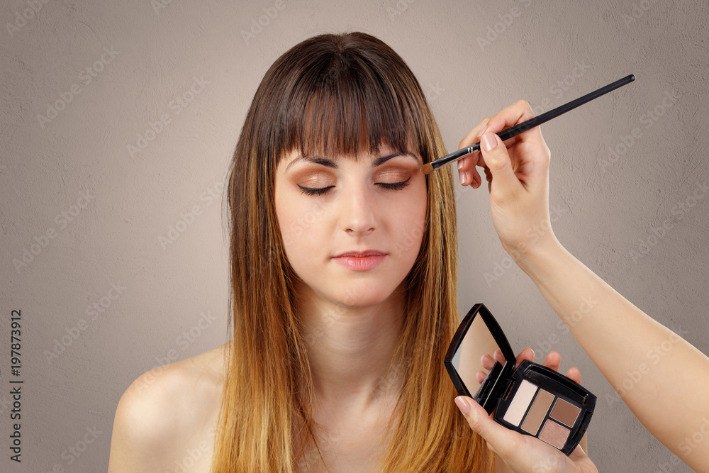 Obraz premium Portrait of young pretty woman at beautician and hairdresser 