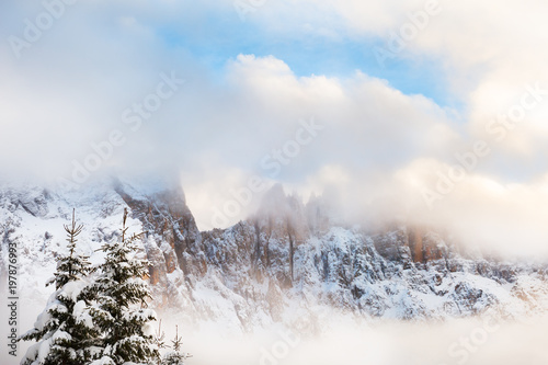 Winter Dolomite Alps in foggy day.