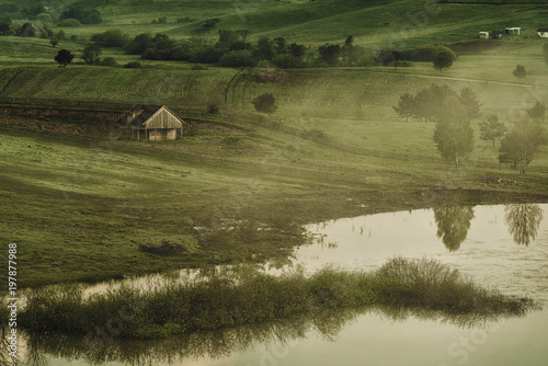 Wooden house at the small lake, Nisici plateau, Bosnia and Herzegovina