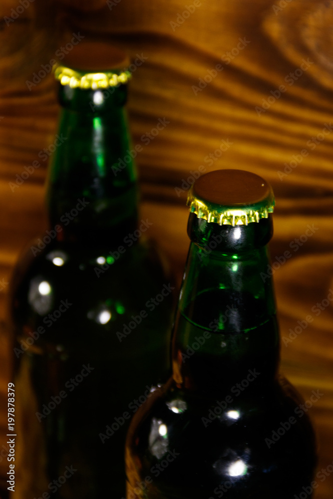 Two bottles of beer on wooden table