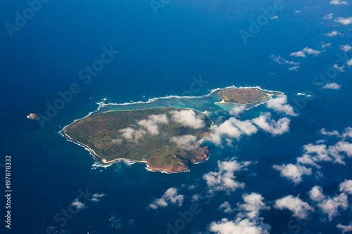 Top view aerial photo, tropical island in open sea © Artem Zakharov