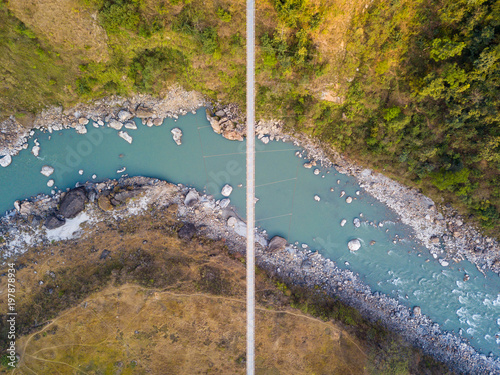 Drone view of the suspension bridge over the Kali Gandaki river between Kushma and Balewa in Nepal photo