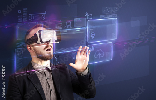 Amazed businessman with virtual reality charts and data in front of him