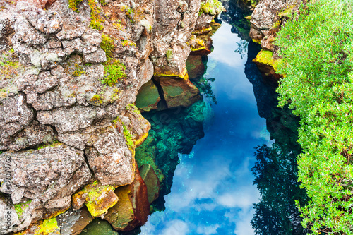 Cliffs and deep fissure in Thingvellir National Park, southern Iceland