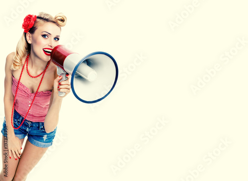 Happy woman holding megaphone, in pin-up style
