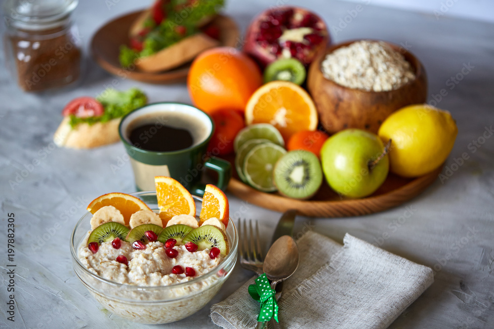 Breakfast still life with oatmeal porridge, fruits and coffee cup, top view, selective focus, shallow depth of field. Breakfast still life with oatmeal porridge, fruits and coffee cup, top view, selective focus, shallow depth of field.