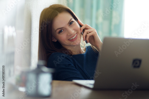 Girl working at home at computer