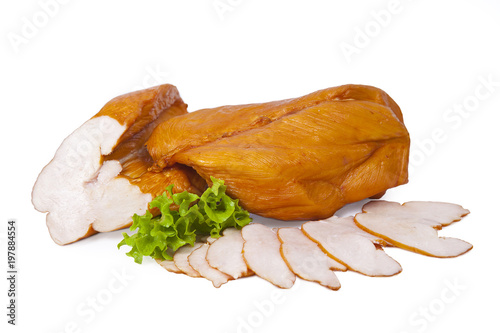 Smoked chicken breast whole and partially sliced. Isolated on white background