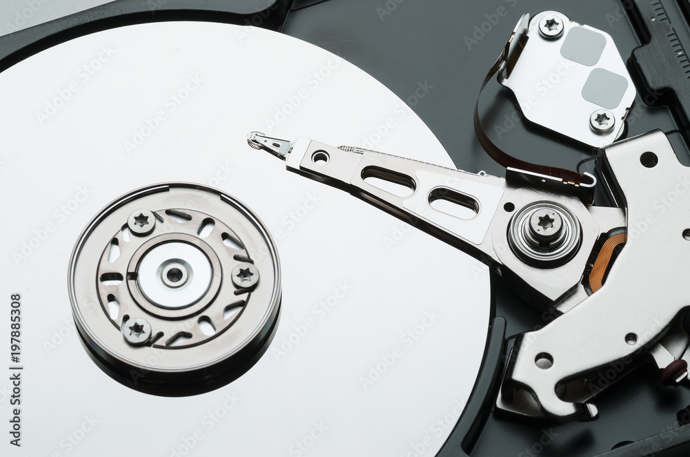 Hard drive with the lid open. High contrast, close-up Hard drive with the lid open. High contrast, close-up