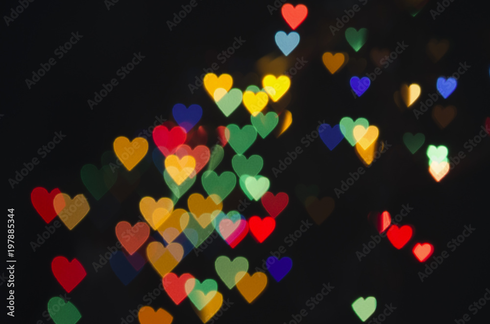 Bright hearts on a dark background. Bokeh, soft focus Bright hearts on a dark background. Bokeh, soft focus