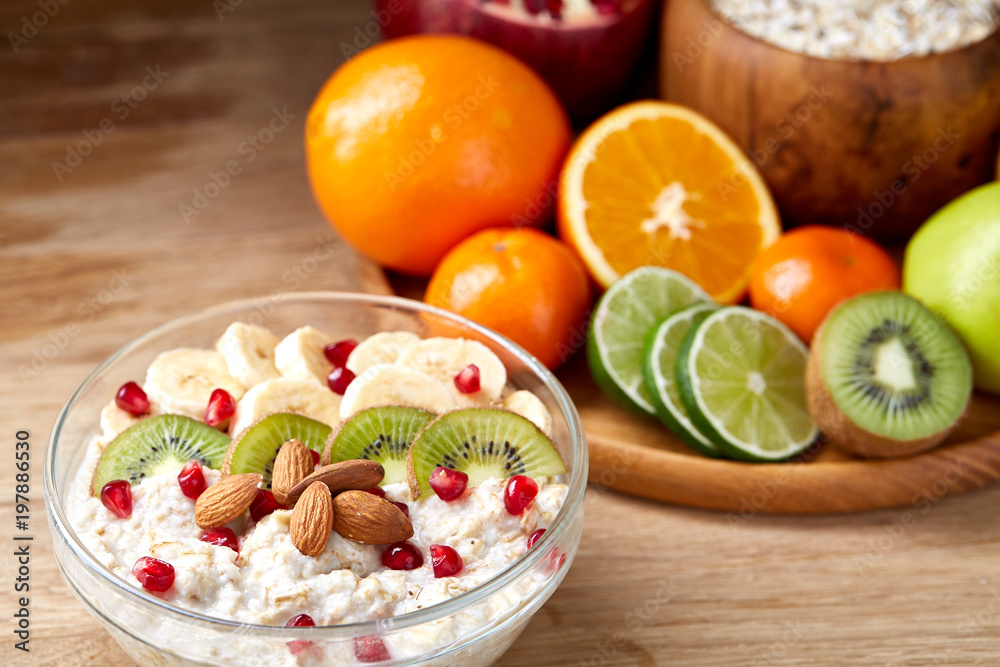 Breakfast still life with oatmeal porridge and fruits, top view, selective focus, shallow depth of field. Breakfast still life with oatmeal porridge and fruits, top view, selective focus, shallow depth of field.