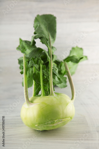 fresh green cabbage turnip on white wooden kitchen plate, can be used as background photo