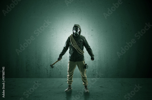 Bad agent in a dark room with arms on his hand and gas mask 