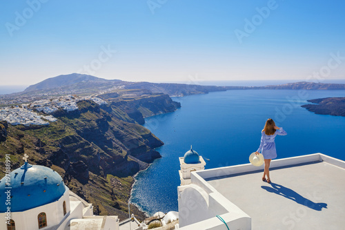 Young woman  looks at the marine landscape