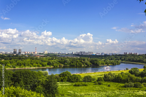 Beautiful view of Moscow skyline, river, and the city in the background from the hiking trail in Kolomenskoye Mansion, Moscow, Russia. 