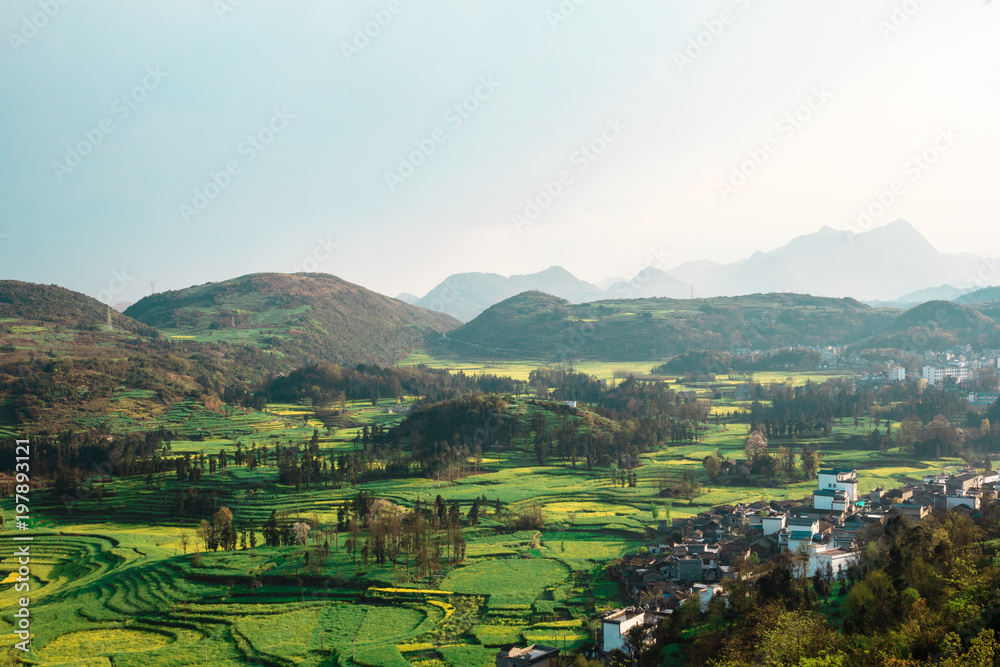 View on mountains and rapeseed fields in Yunnan