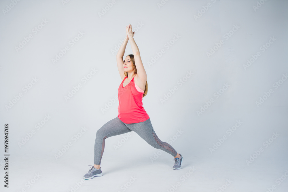 Pregnant girl in sportswear is engaged in fitness Pregnant girl in sportswear is engaged in fitness