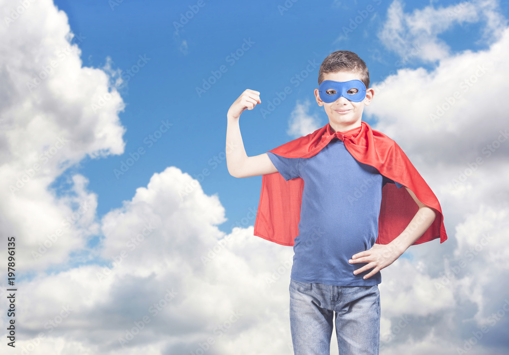 Superhero kid showing his strength. Success and confidence concept Superhero kid showing his strength. Success and confidence concept